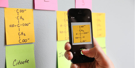 image of a person scanning a post it note to their phone