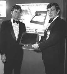 A Photo of Dr. G. Samuel Hurst (on the left) with his invention.