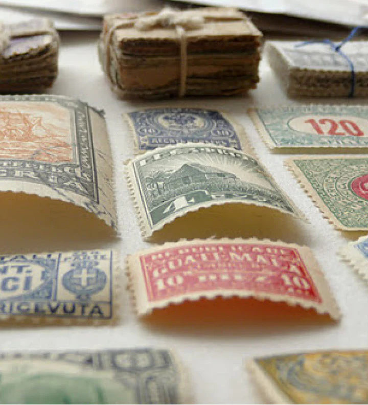 A picture that shows a collection of different tiny postage stamps. 